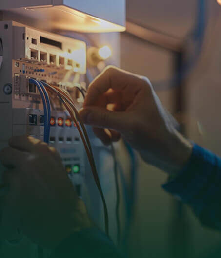 Whole House Re-Wiring Services Electrician performing house rewiring work